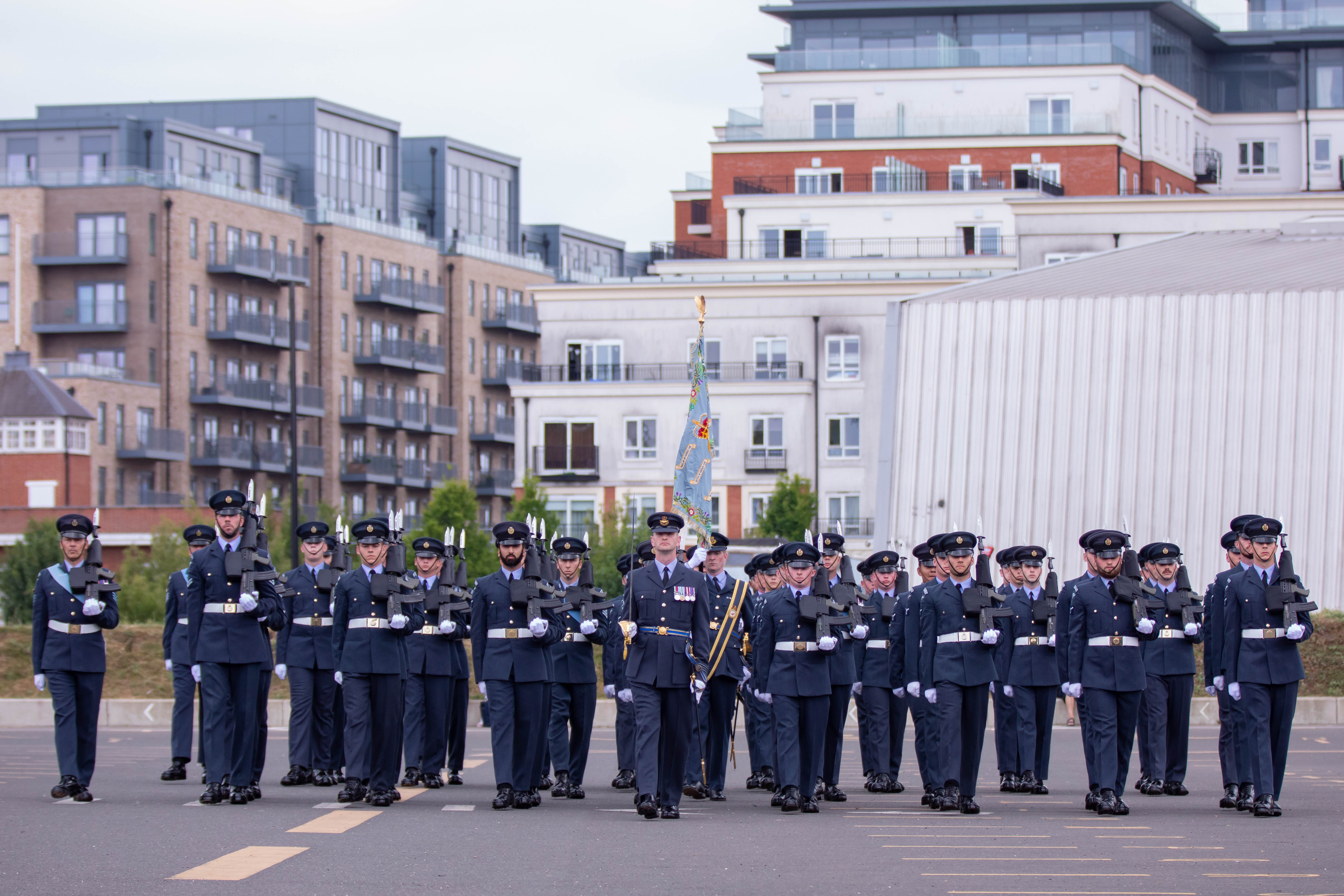 Image shows aviators parading with Standard.